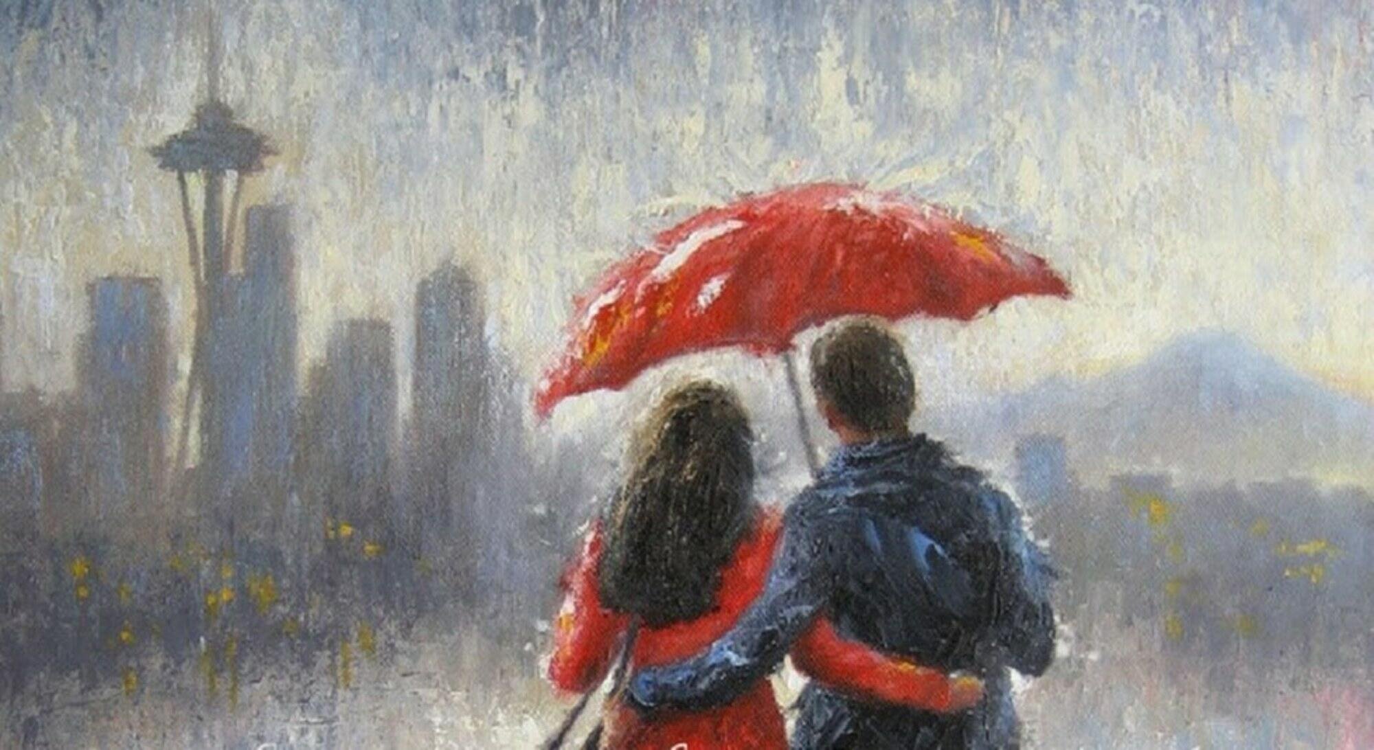 Мужчина и женщина под зонтом в дождь
